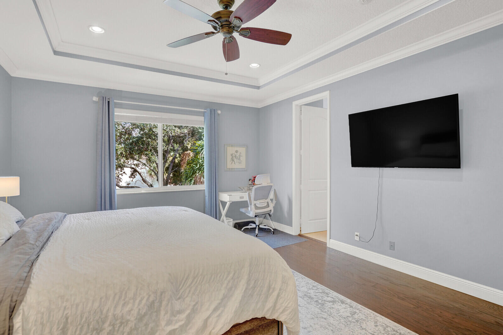 2005 Foxtail View Court West Palm Beach, FL 33411 - Photo 28 of 51 a bedroom with a bed and a flat screen tv