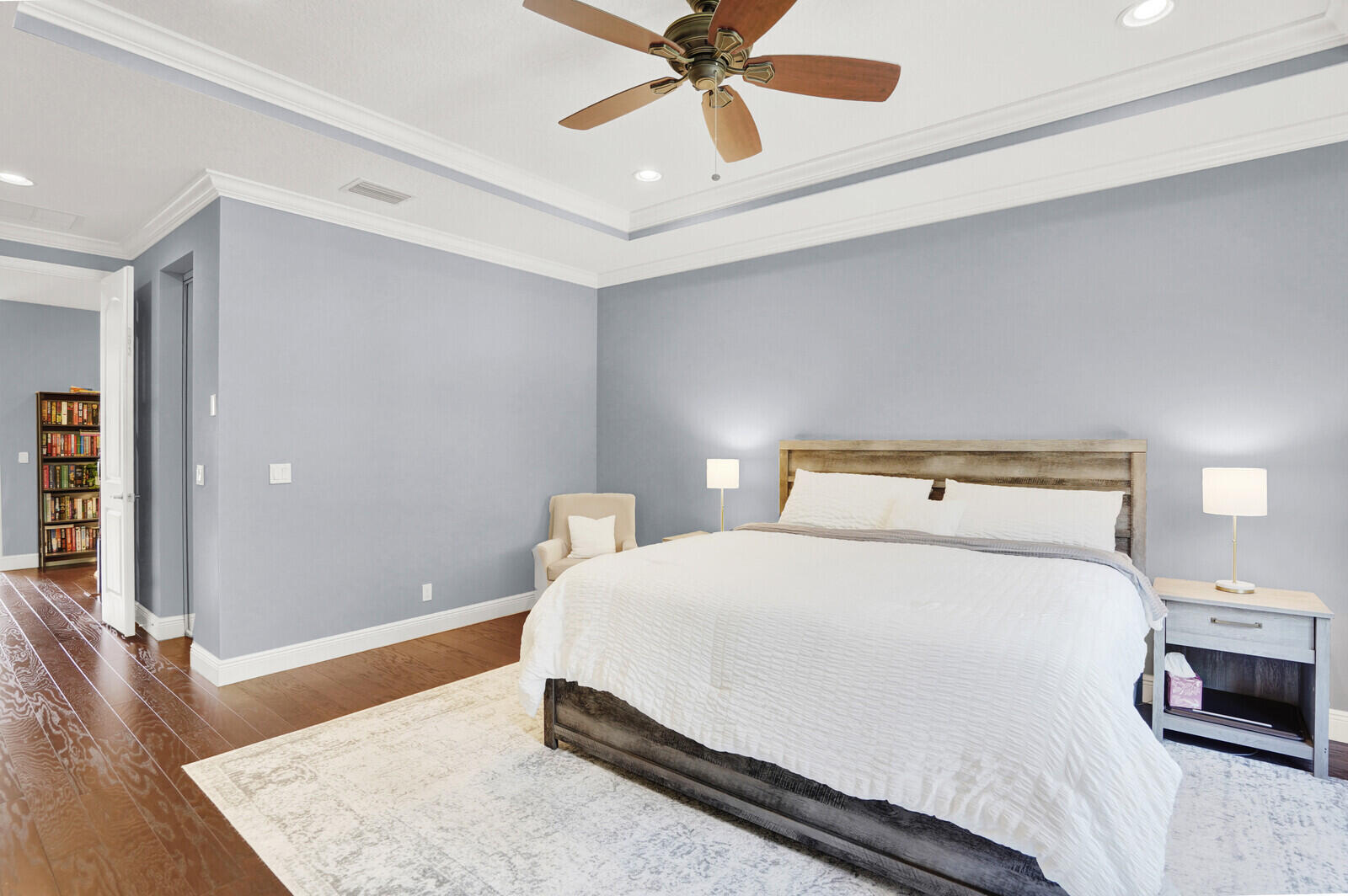 2005 Foxtail View Court West Palm Beach, FL 33411 - Photo 30 of 51 a bedroom with a bed and a chandelier