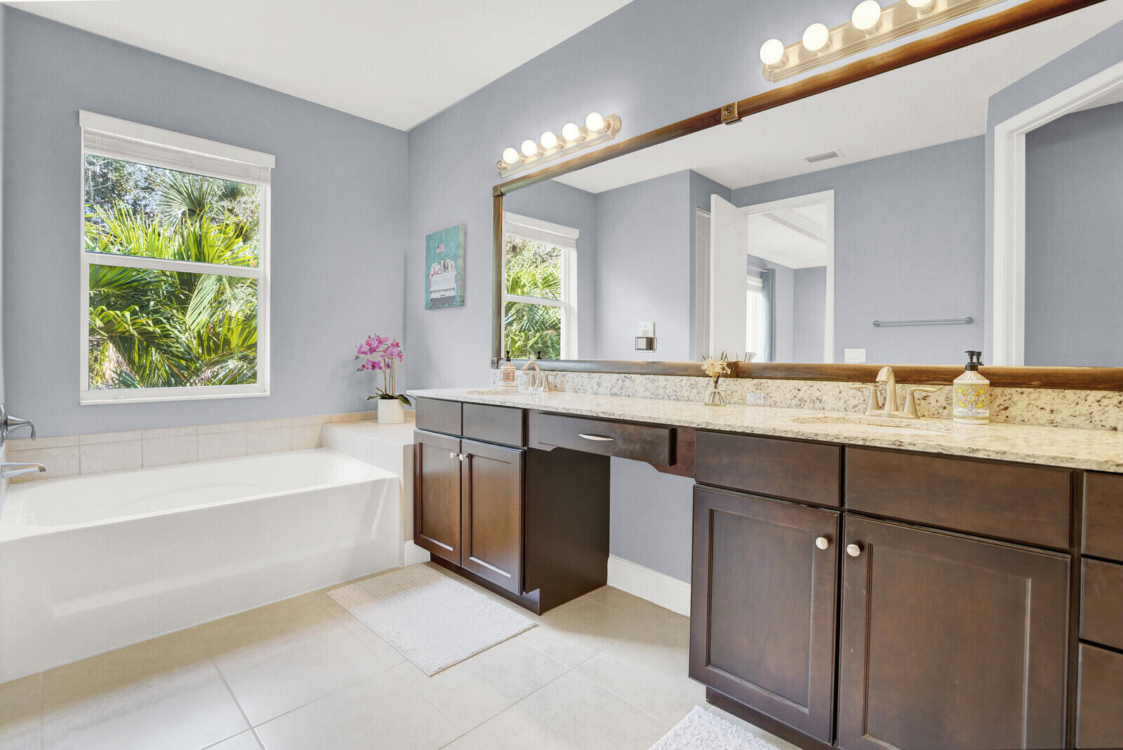 2005 Foxtail View Court West Palm Beach, FL 33411 - Photo 31 of 51 a bathroom with a granite countertop bathtub a sink and a window