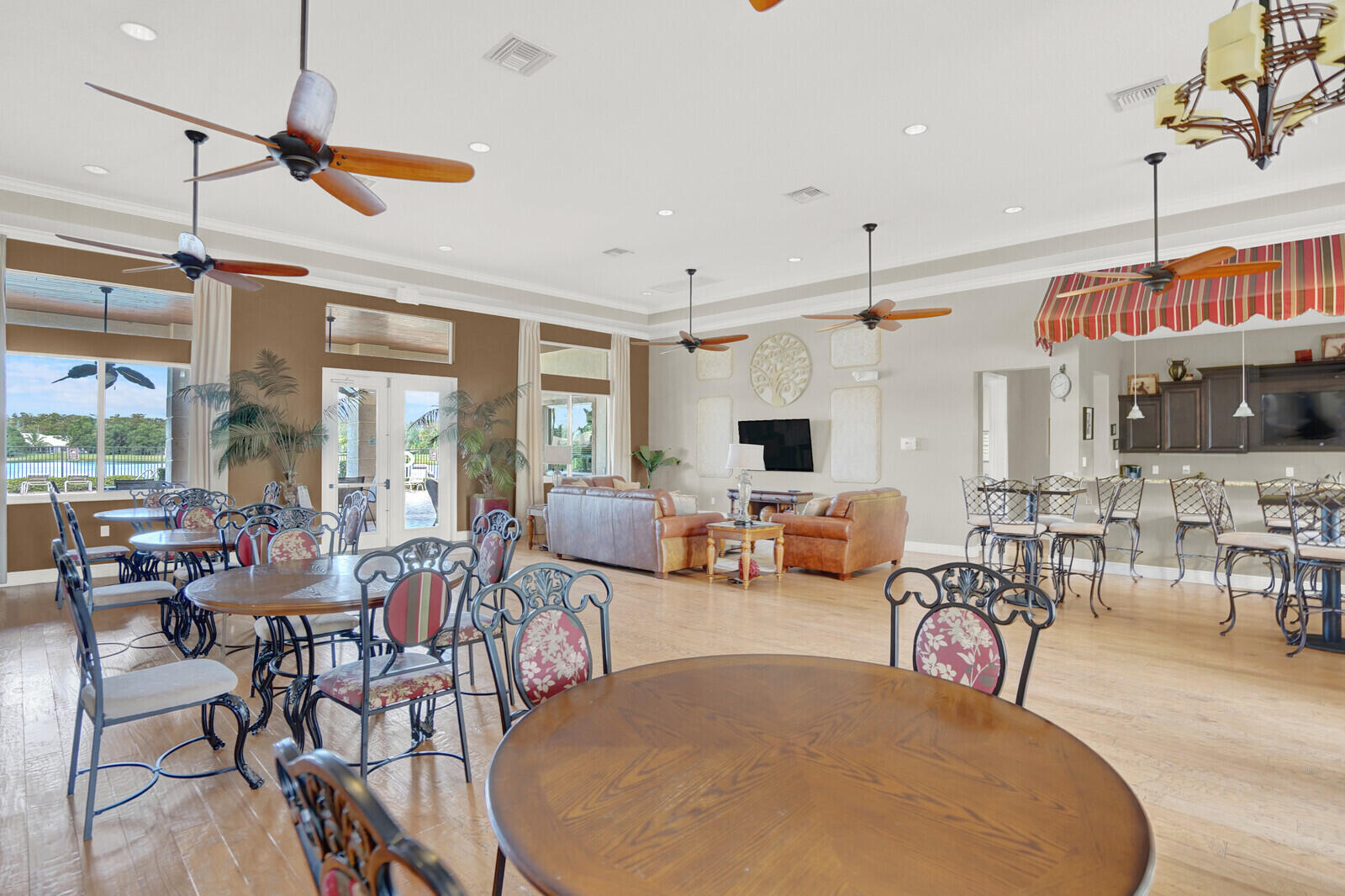 2005 Foxtail View Court West Palm Beach, FL 33411 - Photo 44 of 51 a living room with lots of furniture and a flat screen tv