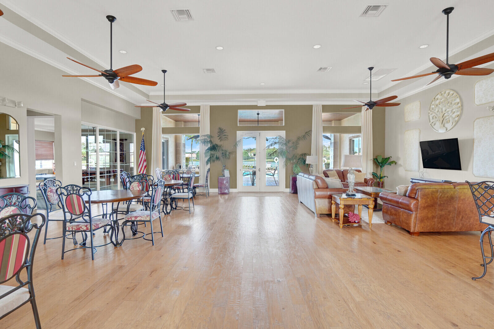 2005 Foxtail View Court West Palm Beach, FL 33411 - Photo 45 of 51 a living room with furniture a flat screen tv and a window