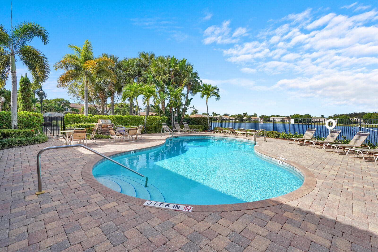2005 Foxtail View Court West Palm Beach, FL 33411 - Photo 49 of 51 a view of a swimming pool and lounge chairs