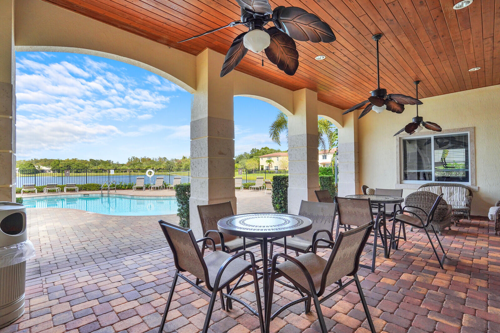 2005 Foxtail View Court West Palm Beach, FL 33411 - Photo 50 of 51 a view of a patio with a table and chairs