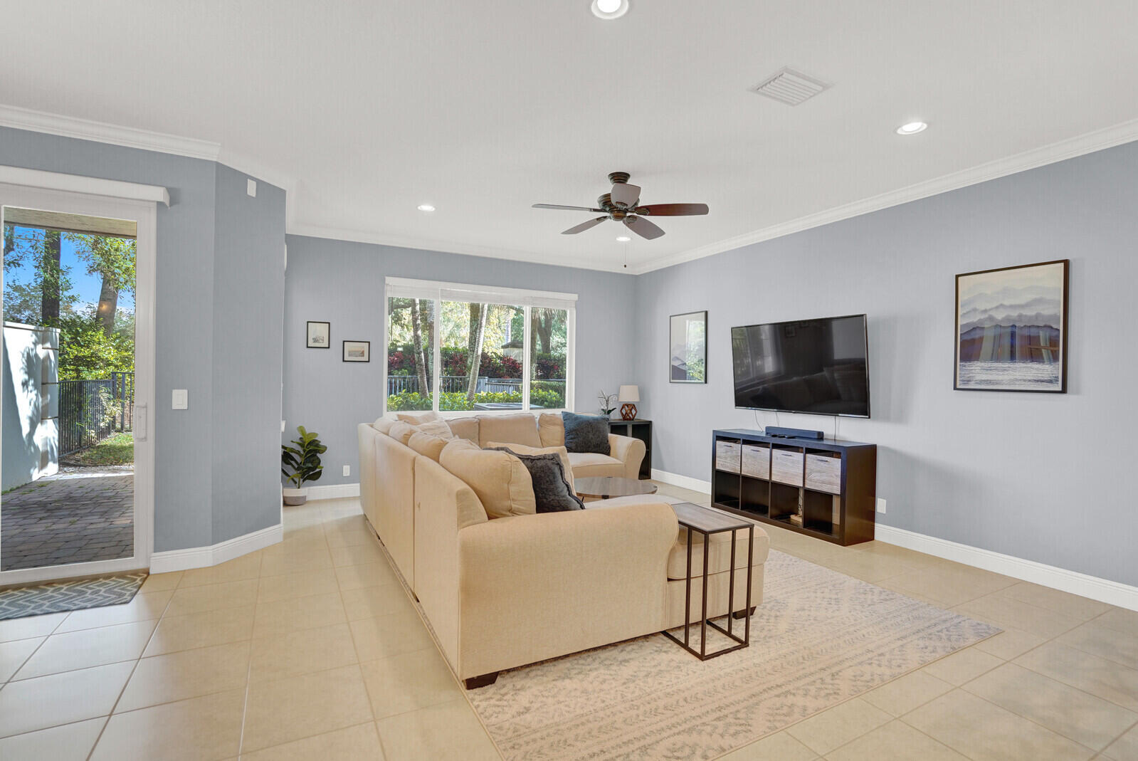 2005 Foxtail View Court West Palm Beach, FL 33411 - Photo 9 of 51 a living room with furniture and a flat screen tv