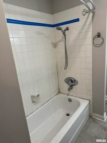 a bathroom with a bath tub