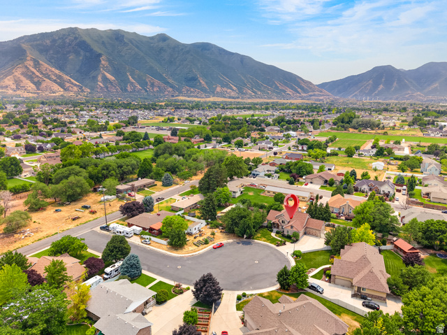 1279 West 1500th Street North Mapleton, UT 84664 - Photo 76 of 83 Aerial depiction of a residential neighborhood with mountain backdrops
