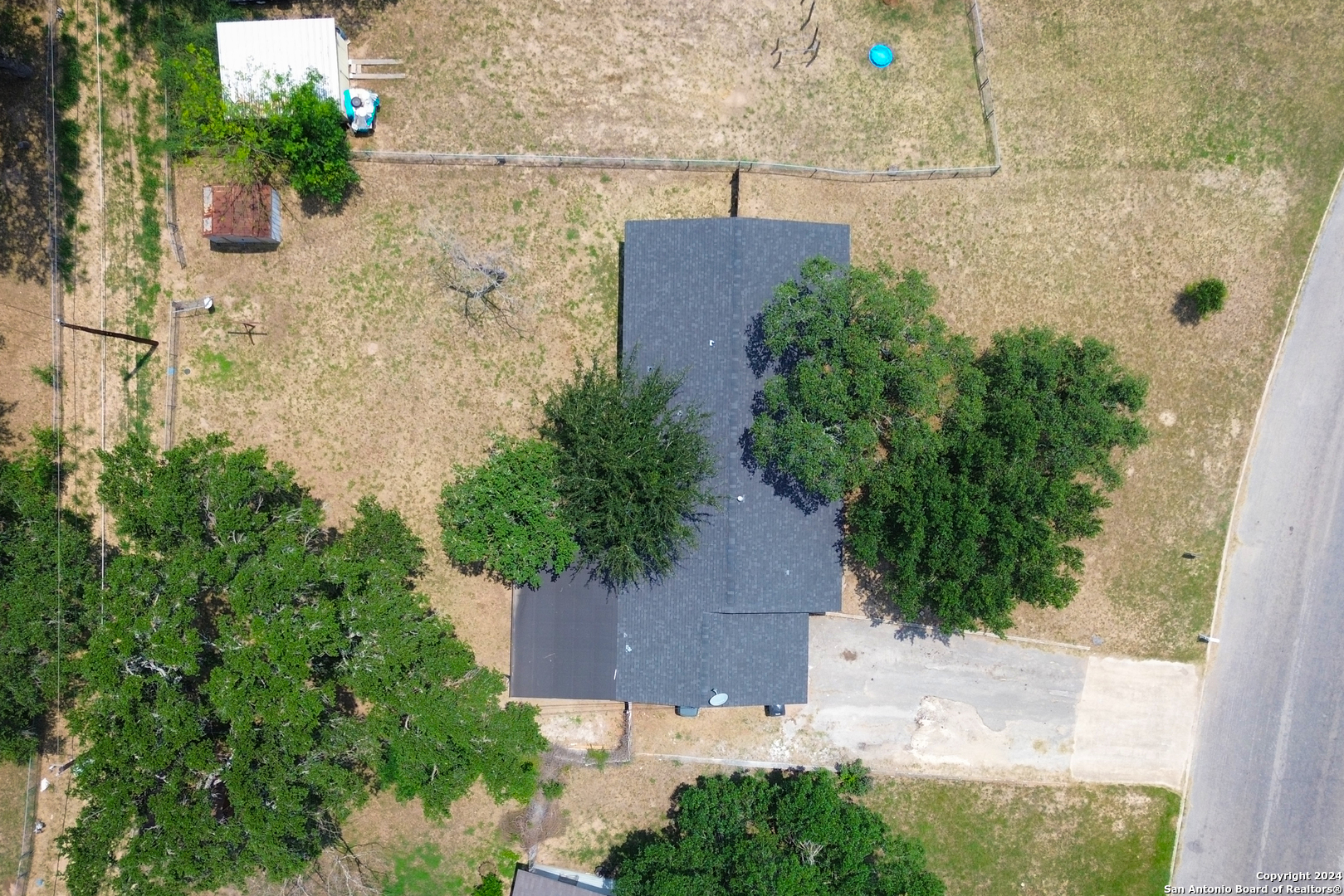 609 Hickory Highway Devine, TX 78016 - Photo 17 of 17 an aerial view of a house with a yard