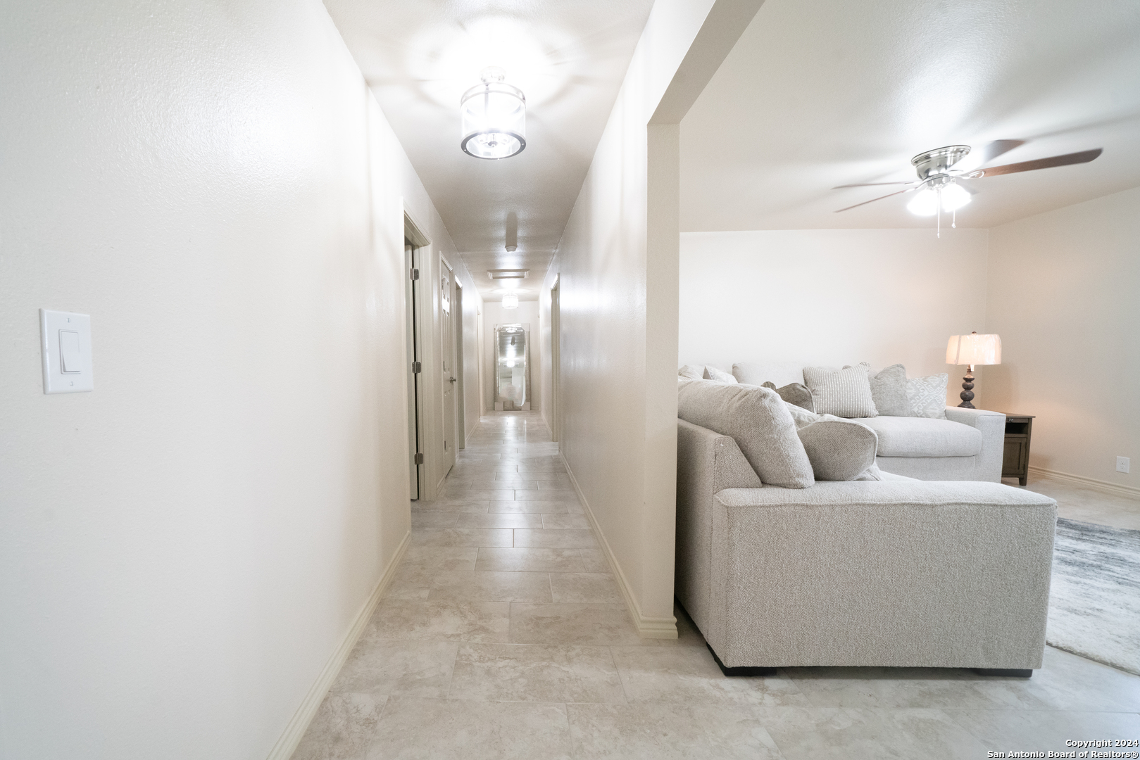 609 Hickory Highway Devine, TX 78016 - Photo 4 of 17 a living room with furniture and a chandelier