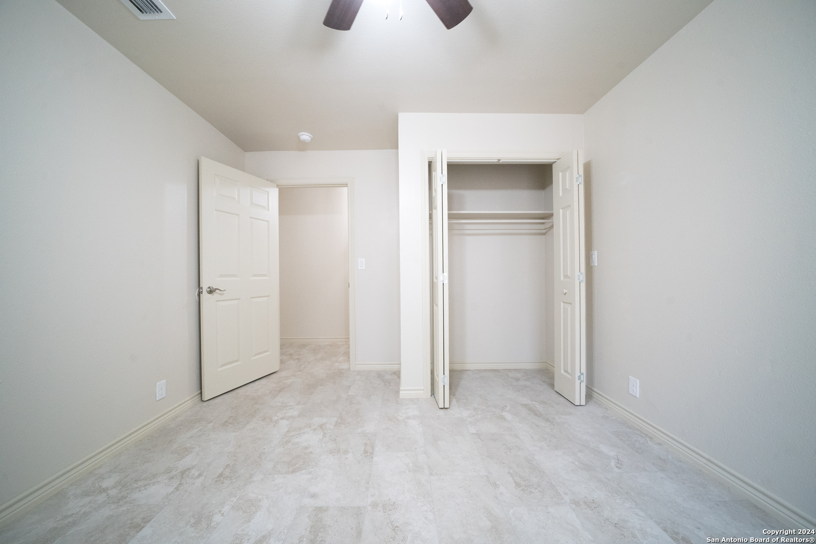 609 Hickory Highway Devine, TX 78016 - Photo 7 of 17 an empty room with closet and windows