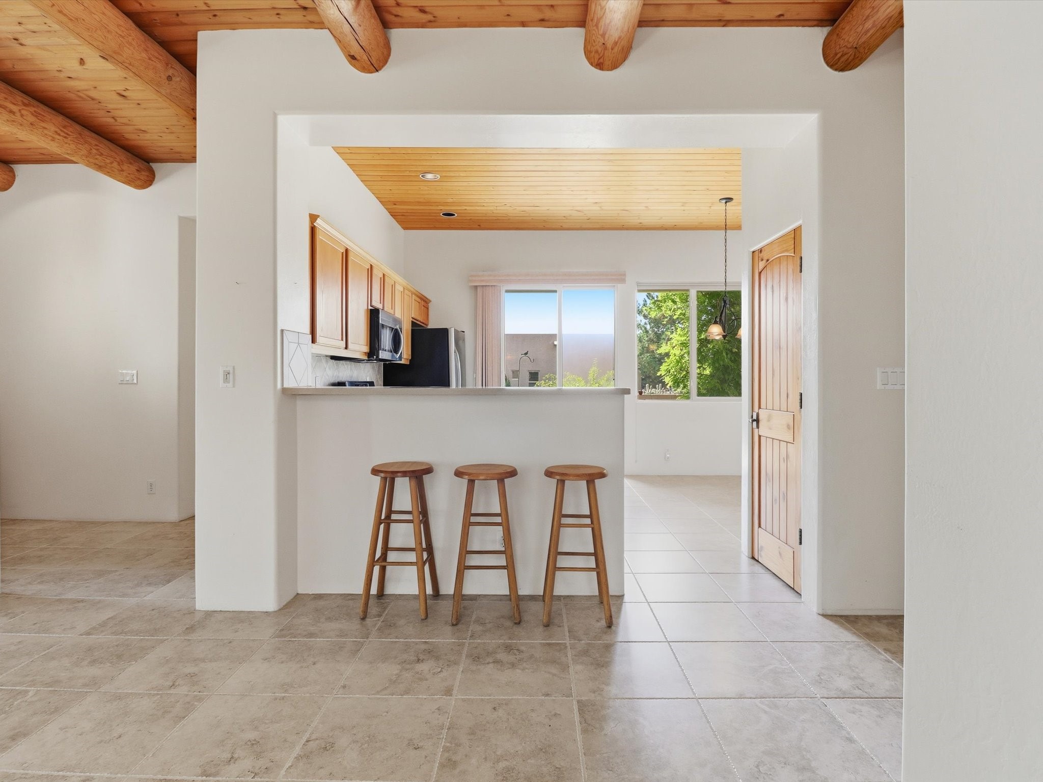 Bright kitchen with convenient breakfast bar seating.