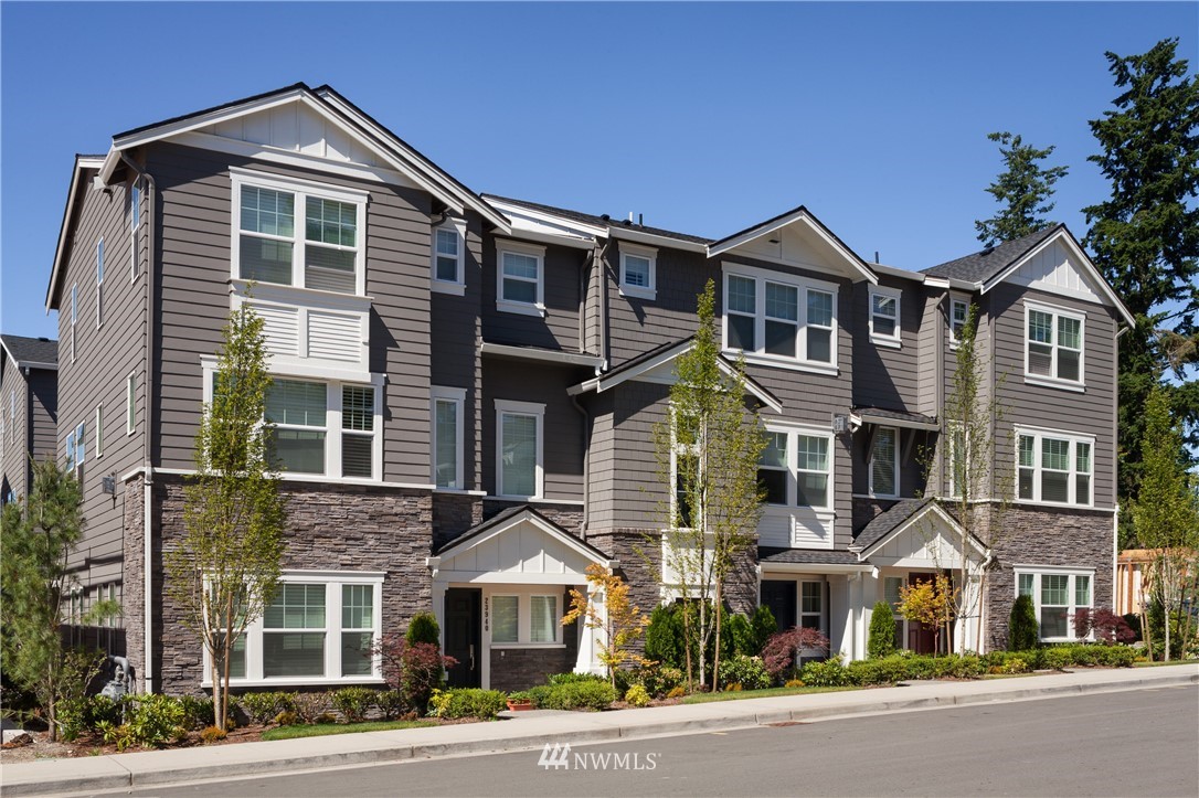 26542 Northeast Big Rock Road, Unit 101 Duvall, WA 98019 - Photo 19 of 19 a front view of a house with a yard