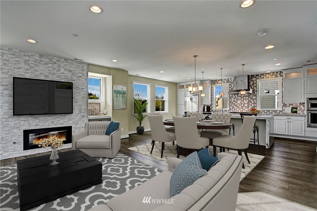 26542 Northeast Big Rock Road, Unit 101 Duvall, WA 98019 - Photo 5 of 19 a living room with fireplace furniture and a flat screen tv