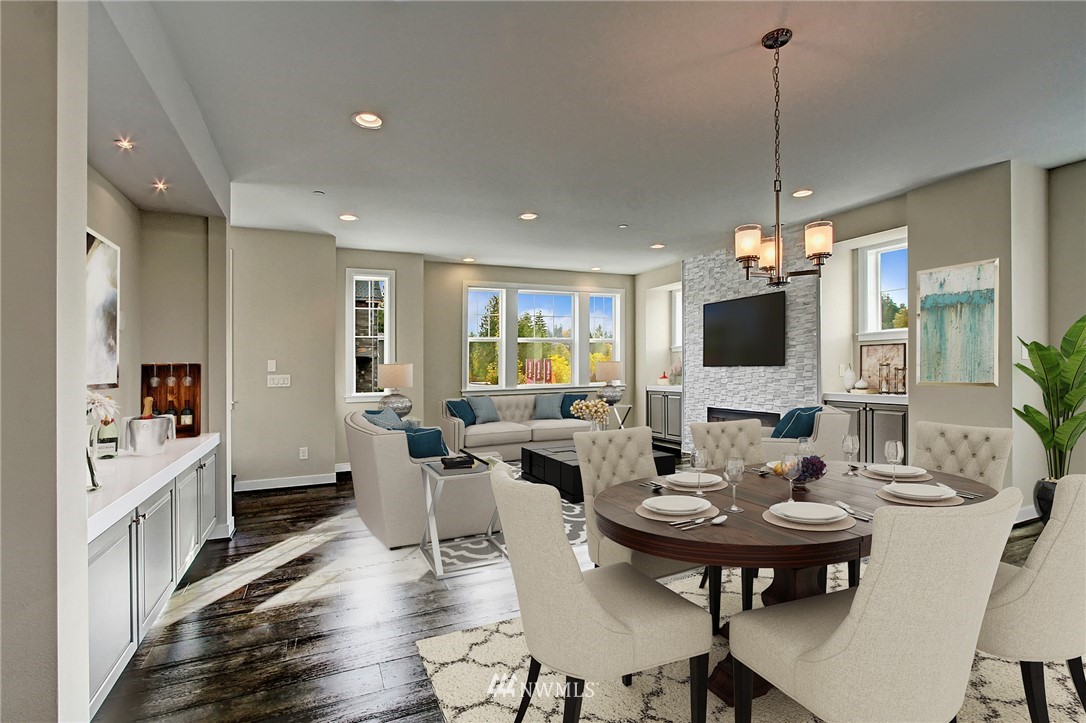 26542 Northeast Big Rock Road, Unit 101 Duvall, WA 98019 - Photo 7 of 19 a view of a dining room with furniture window and wooden floor