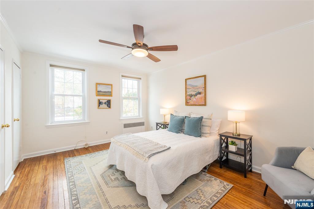 101 Gates Avenue, Unit 2A Montclair, NJ 07042 - Photo 16 of 21 a bedroom with a bed and wooden floor