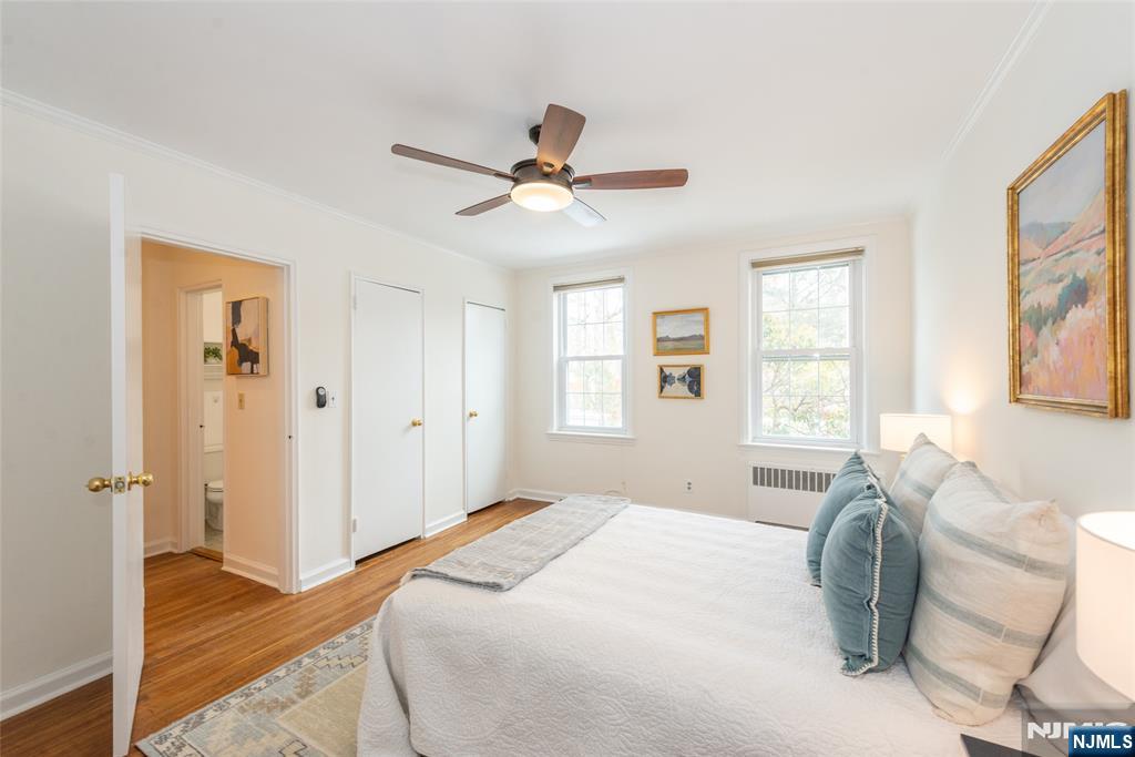 101 Gates Avenue, Unit 2A Montclair, NJ 07042 - Photo 18 of 21 a bedroom with a bed and wooden floor