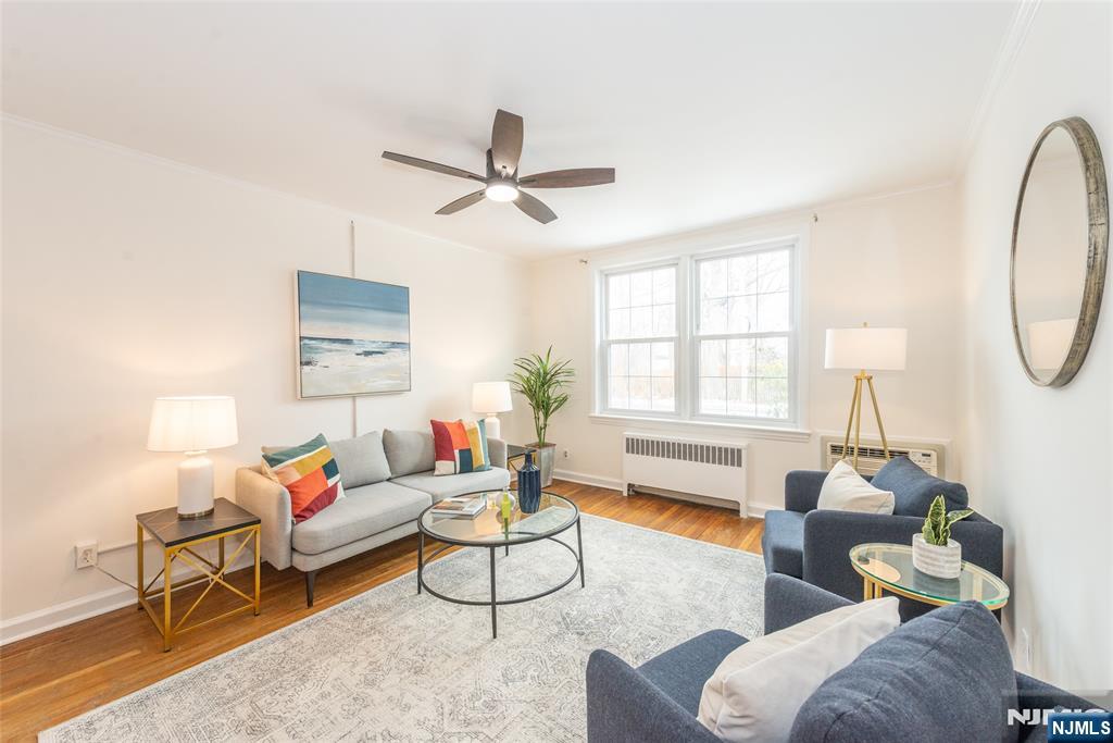 101 Gates Avenue, Unit 2A Montclair, NJ 07042 - Photo 5 of 21 a living room with furniture and a large window