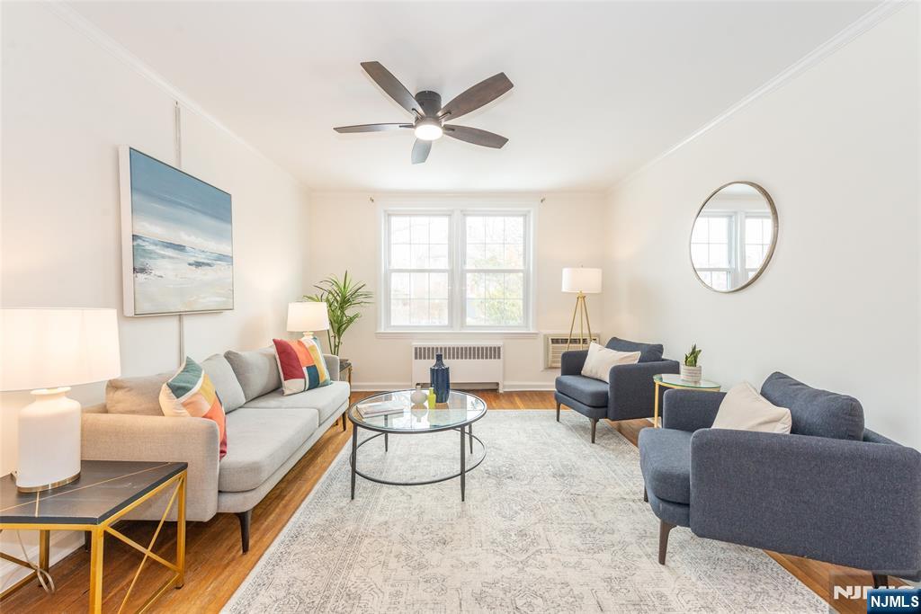 101 Gates Avenue, Unit 2A Montclair, NJ 07042 - Photo 6 of 21 a living room with furniture and a window