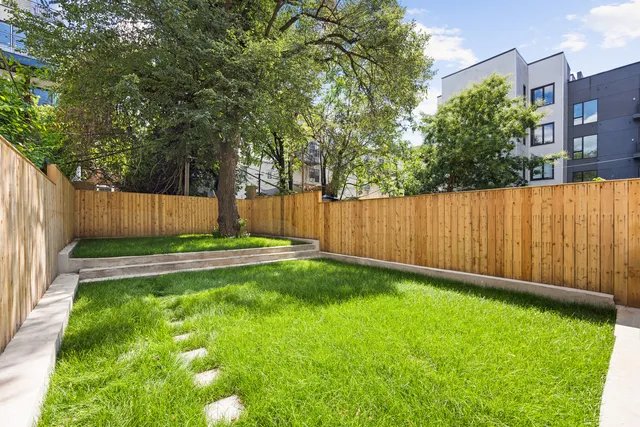a bedroom with a large bed and a couch
