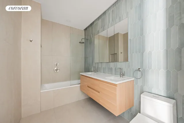 a bathroom with a sink a mirror and a bathtub