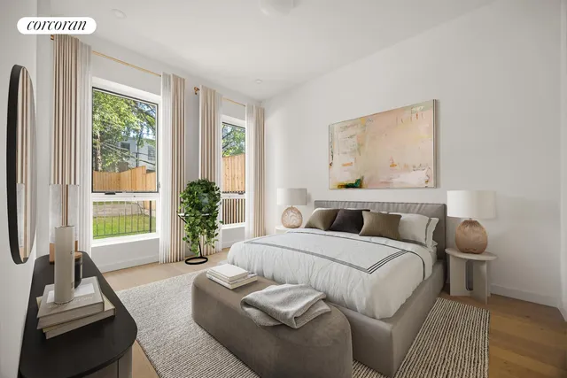 a bedroom with a large bed and a couch