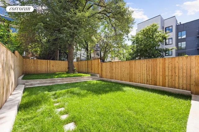 a bathroom with a tub a sink and a mirror