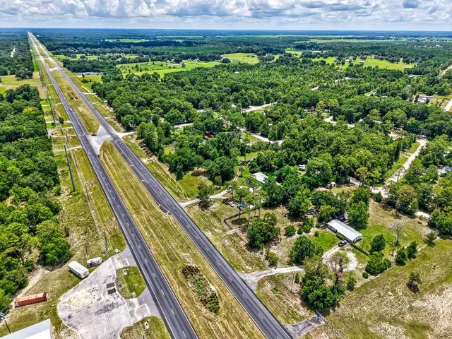 a view of a garden with an outdoor seating