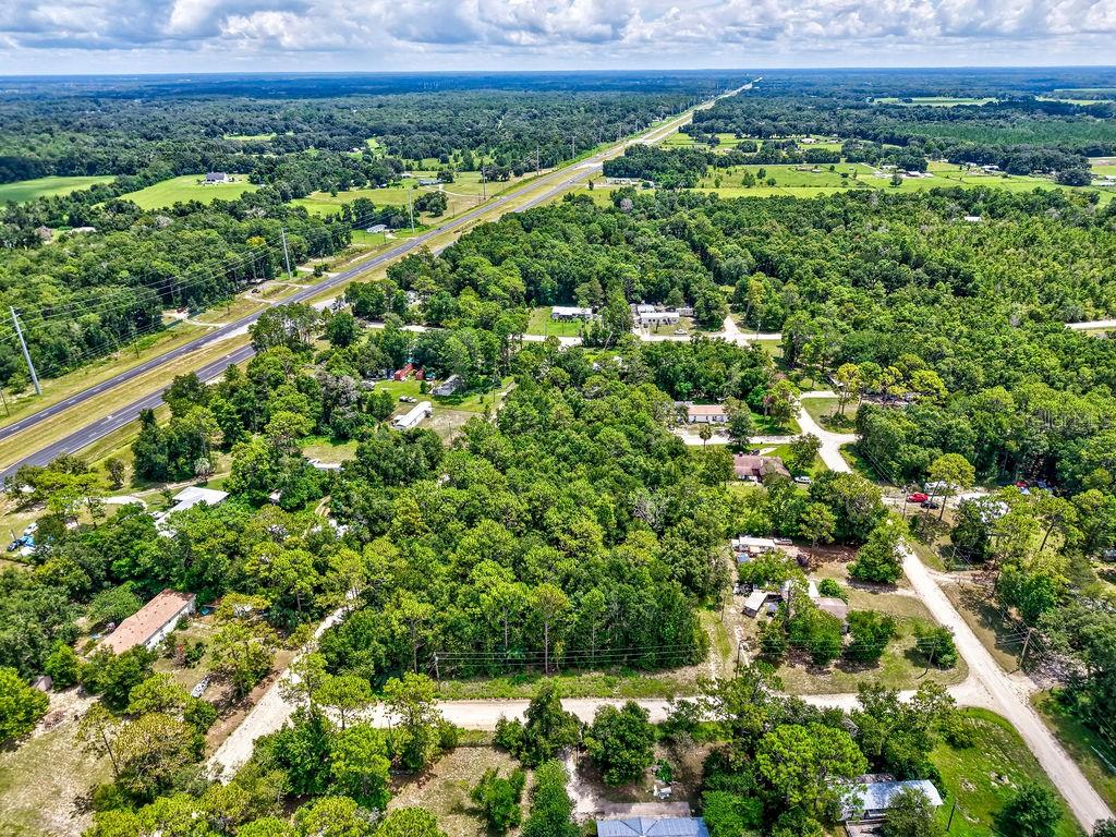 Northeast 51st Place Williston, FL 32696 - Photo 16 of 17 a view of a lush green field