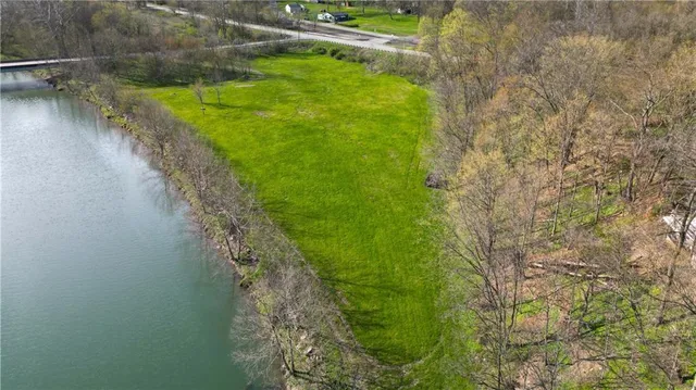 a view of a lake with a yard