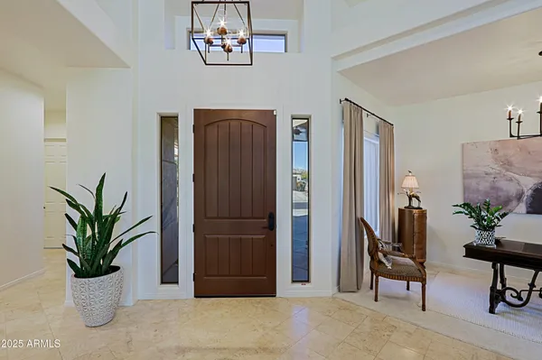 a kitchen with kitchen island a counter top space cabinets and stainless steel appliances