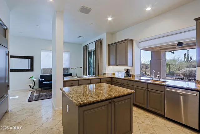 a hallway with cabinets and window