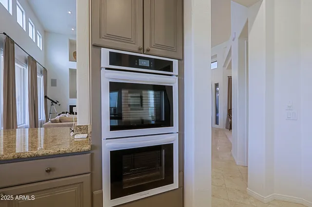 a bath tub sitting in a bathroom next to a window