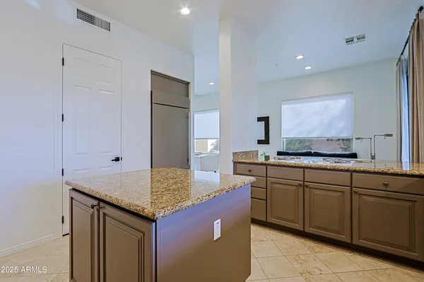 a spacious bathroom with a sink double vanity and a mirror