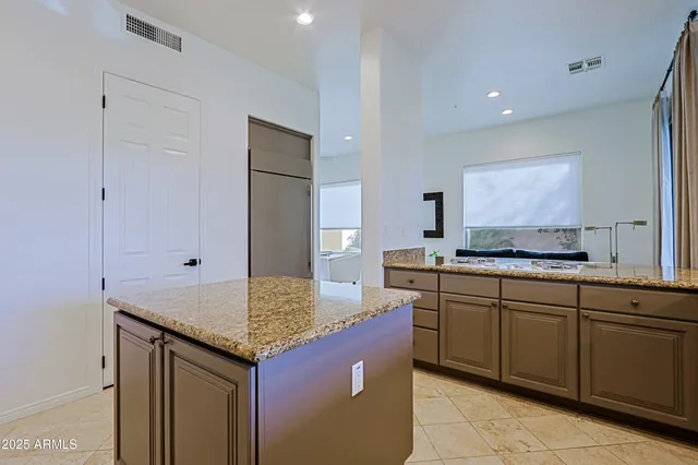 a spacious bathroom with a sink double vanity and a mirror
