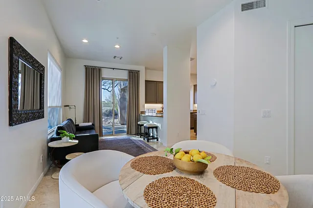 a view of a tall building with a tree in the background