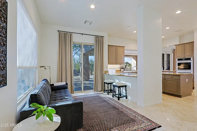 a view of a house with sitting area and garden