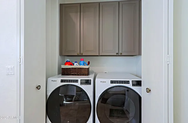 an aerial view of a house with a mountain