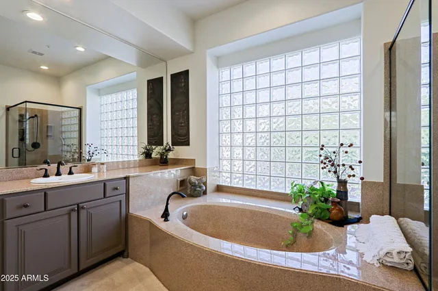 a living room with lots of furniture and a large window