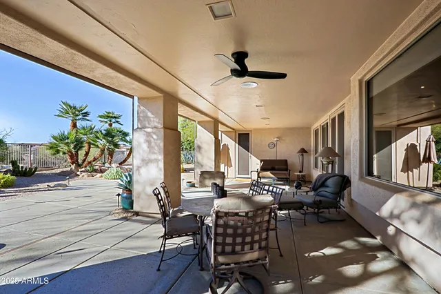 a room with furniture a large window and a sink