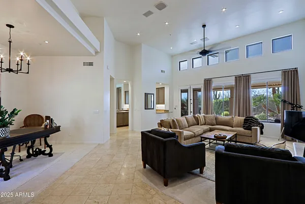 a living room with furniture fireplace and a flat screen tv