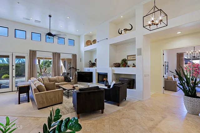 a living room with furniture flat screen tv and a fireplace
