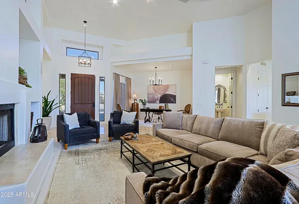 a view of a livingroom with furniture and a potted plant