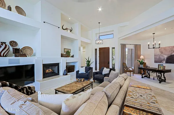 a view of a livingroom with furniture and a potted plant