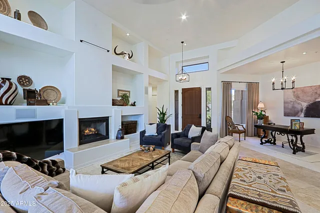 a view of a livingroom with furniture and a potted plant