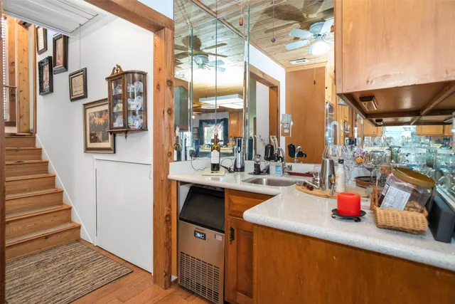 a kitchen with lots of counter top space and furniture