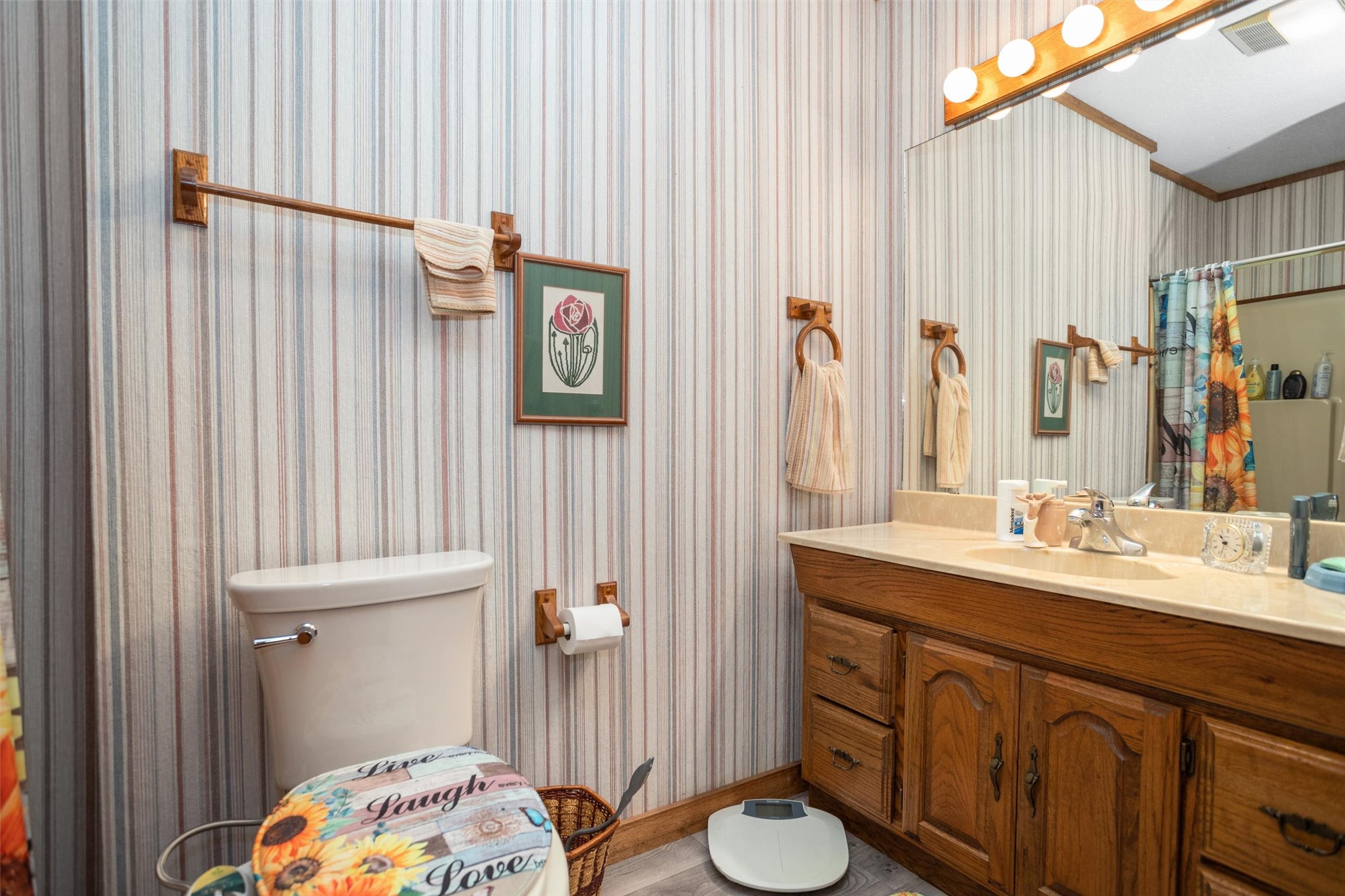 191 Tejas Trail Grapeland, TX 75844 - Photo 20 of 33 a bathroom with a sink a toilet and shower curtain