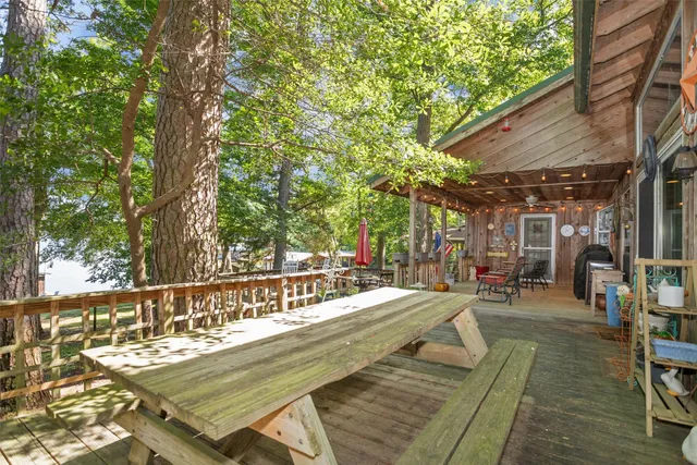 a view of a swimming pool with chairs in patio