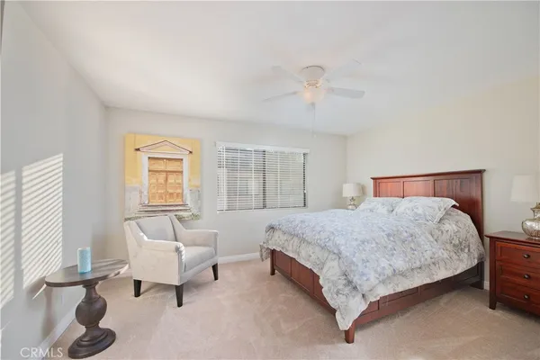 a bedroom with a bed and a couch