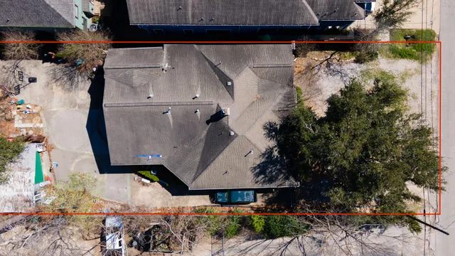 a aerial view of a house with a yard