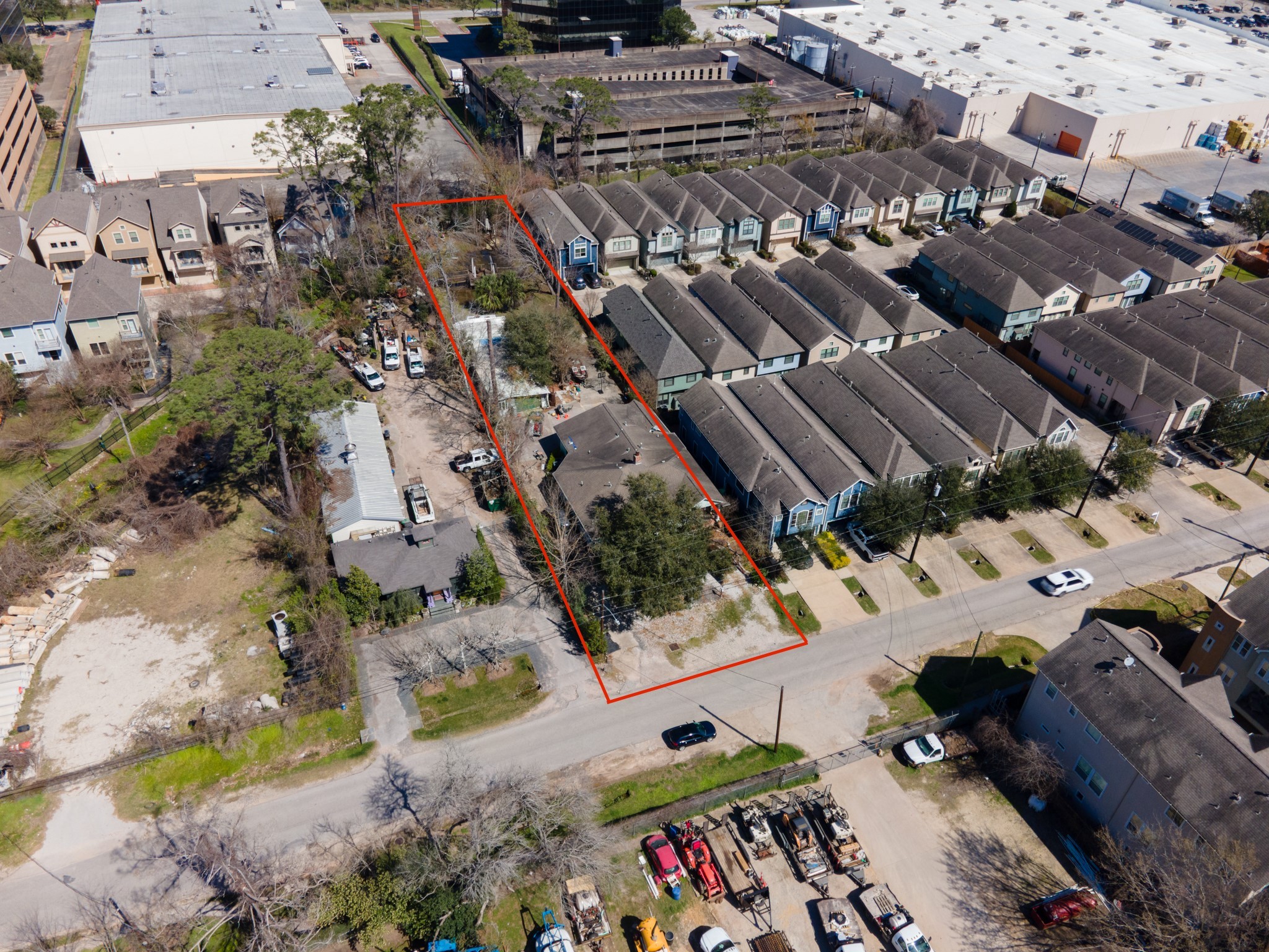 1135 West 26th Street, Unit 5 Houston, TX 77008 - Photo 7 of 30 an aerial view of a parking area with swimming pool
