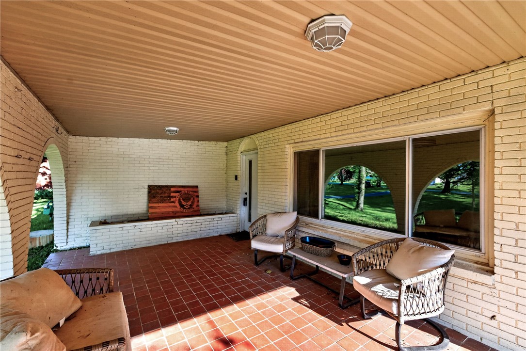 2684 Arthur Road Springfield, OH 45502 - Photo 46 of 69 This inviting patio offers a comfortable outdoor retreat with durable tile flooring and a bright, open atmosphere.